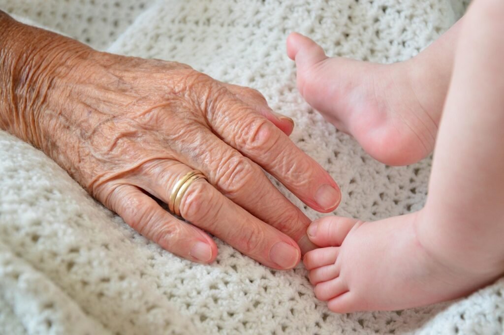elderly, child, feet, hand, wrinkles, generation, young, old, family, grandparent, grandchild, blanket, crochet, knitted, close-up